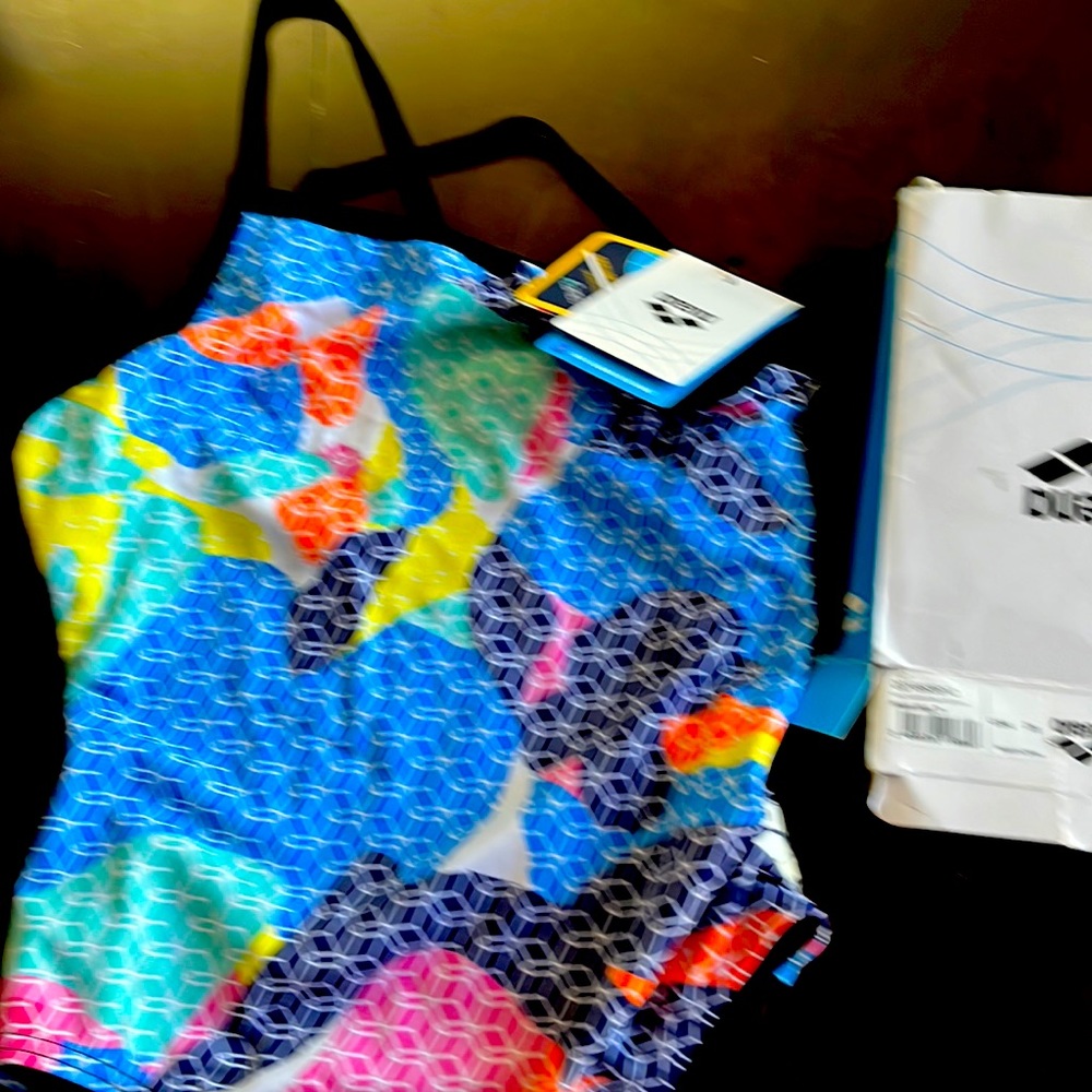Brand new in box tags on pink multi swimsuit.